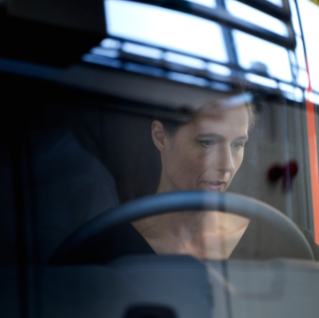Women in truck seen through the windscreen