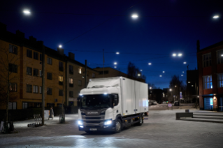 White truck driving in city during night