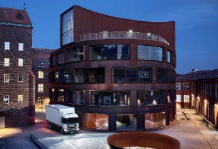 Truck next to building in dusk 