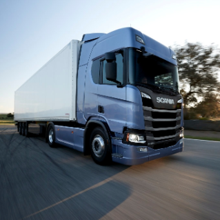 Blue truck driving on road