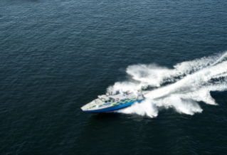 Boat driving at high speed on open water