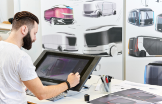 Man working with design on a drawing pad