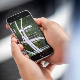 Two hands holding a mobile phone with Scani app