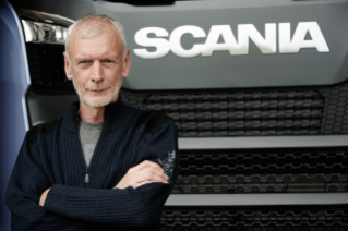 Man standing in front of truck