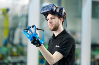 Man in black t-shirt using VR equipment