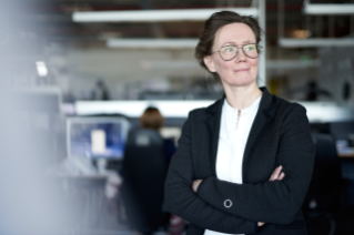 Woman with glasses in office environment